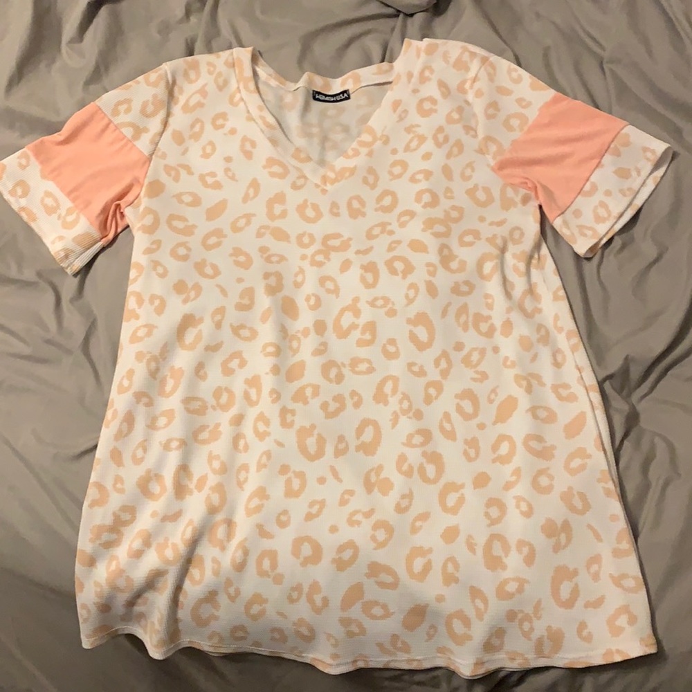Waffle material top, size large definitely a longer fit.